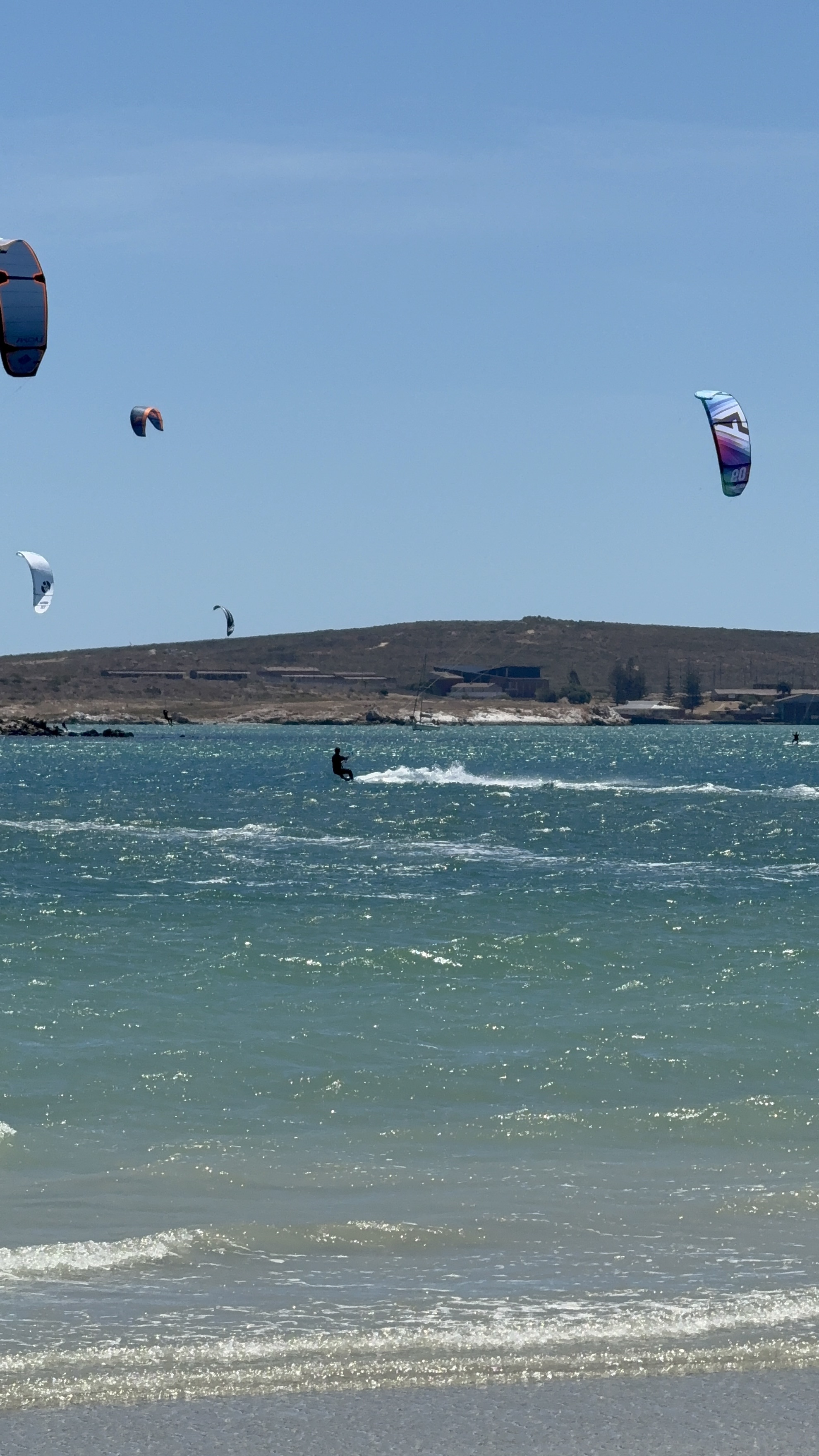 Multiple kitesurfers at Shark Bay Langebaan