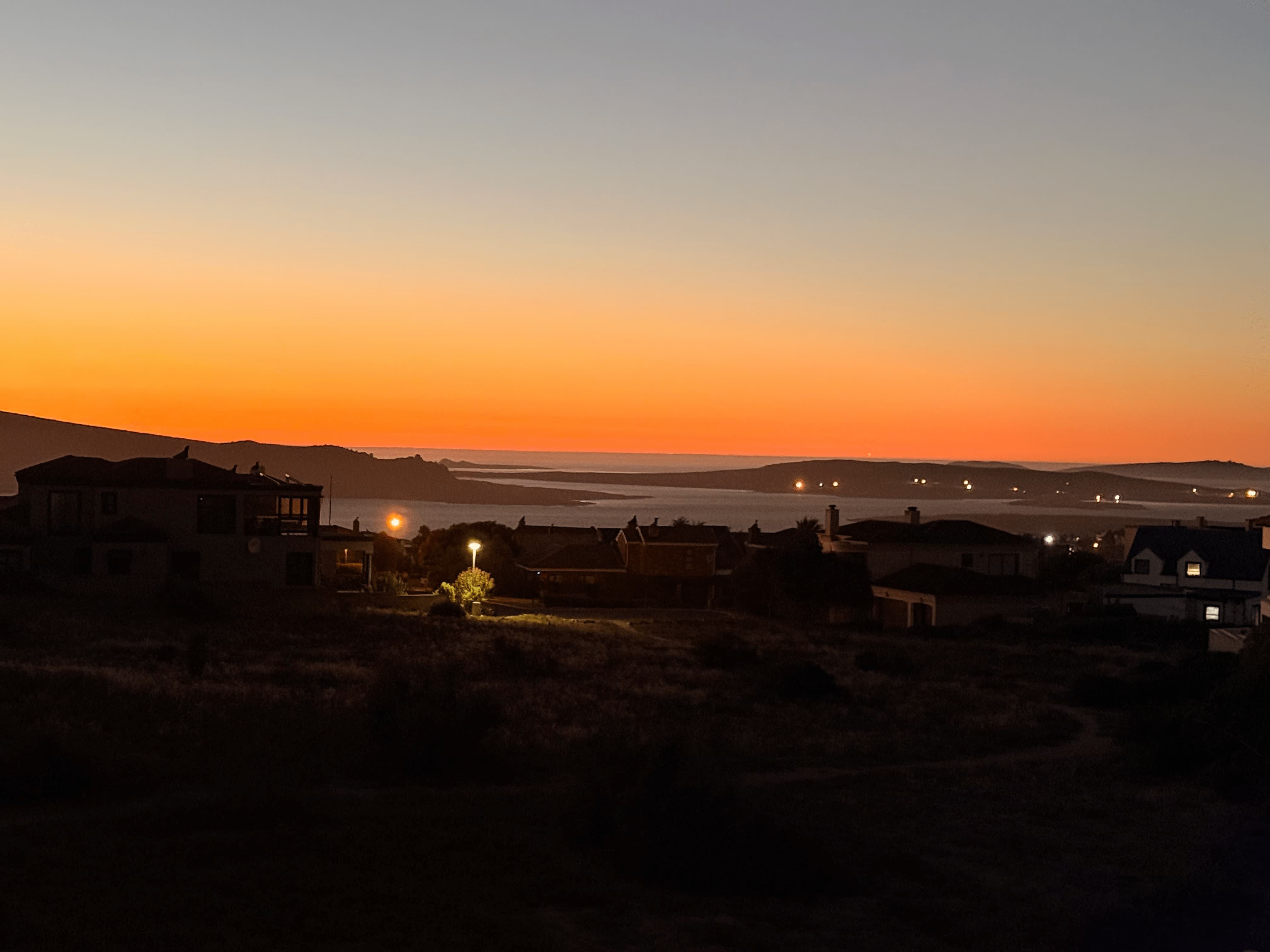 Twilight afterglow over Langebaan with town lights